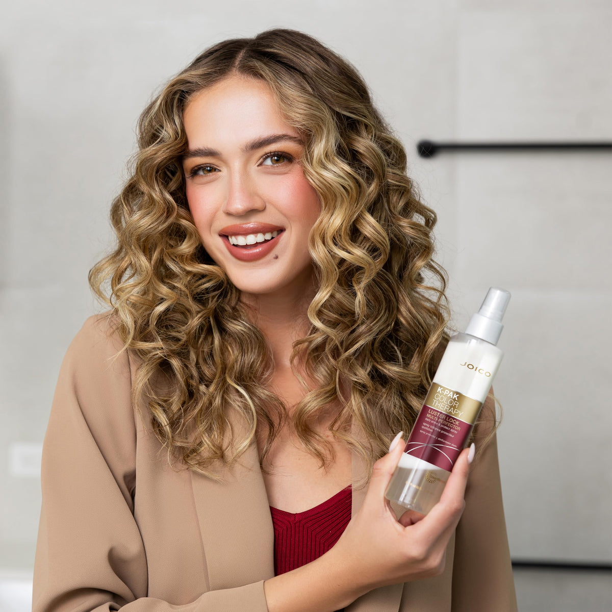 Joico bottle on vanity suggesting daily color-protection benefit
