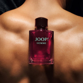 Joop! bottle held in hand showing 6.7 oz scale for purchase clarity