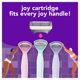 JOY razor next to a ruler showing compact size and travel-friendly design