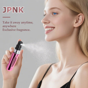 JPNK five colored atomizers displayed in a styled scene for fashionable portability