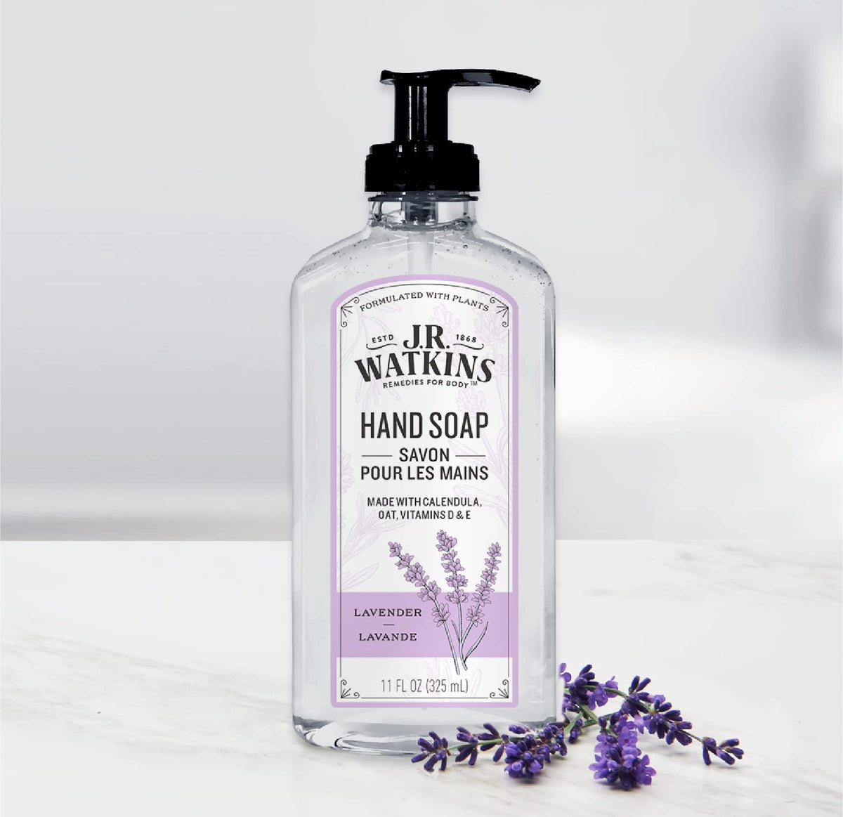 J.R. Watkins three bottles arranged at a kitchen sink conveying consistent scent and convenience