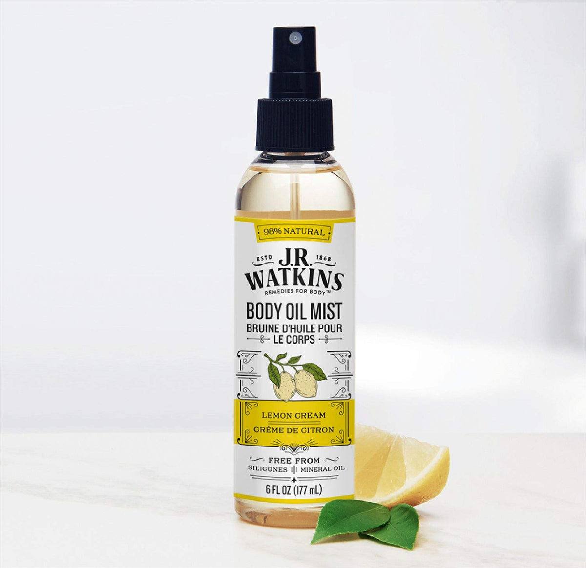 J.R. Watkins bottle in a hand to show 6 fl oz size and portable benefit