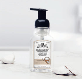 J.R. Watkins bottle next to sink for scale, demonstrating compact 9 fl oz convenience benefit