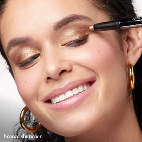 Julep stick applied on model eyelid demonstrating even, crease-resistant wear
