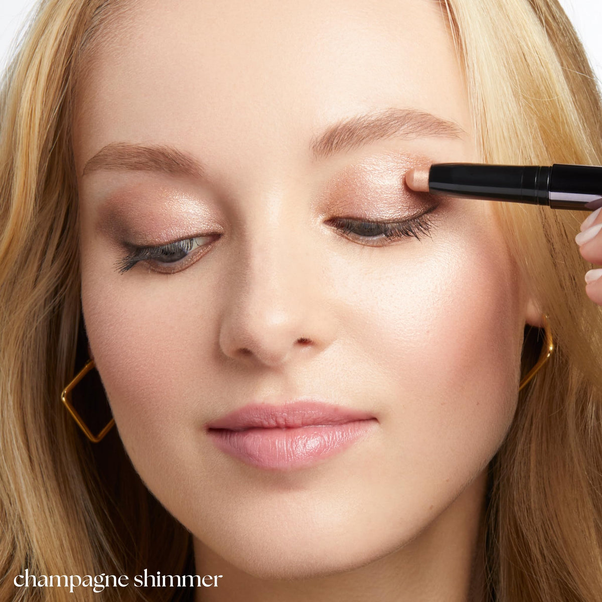 Julep stick applied on eyelid demonstrating crease-proof shimmering finish