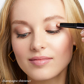 Julep stick applied on eyelid demonstrating crease-proof shimmering finish