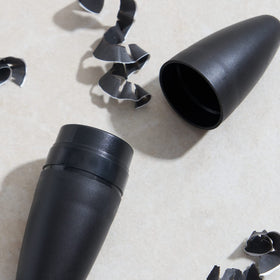 Julep cleaning pick next to sharpener illustrating easy maintenance