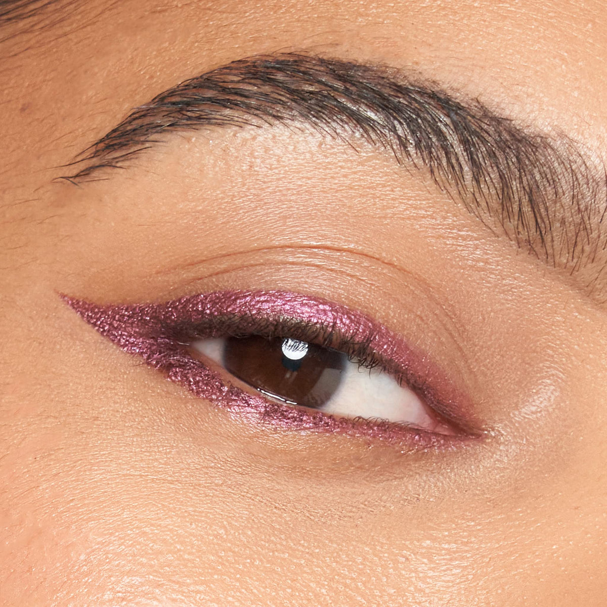Julep swatch on skin showing Fig Shimmer payoff and light-reflecting benefit