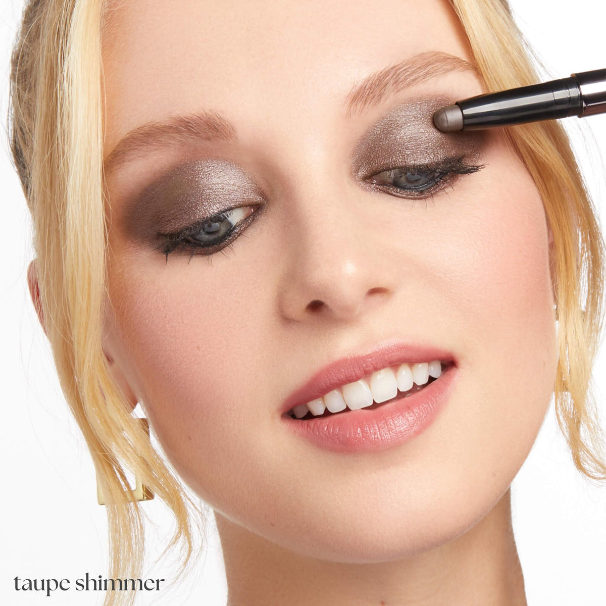 Julep taupe shimmer applied on eyelid closeup showing luminous crease-proof wear