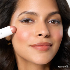 Julep blush stick next to travel pouch highlighting on-the-go use