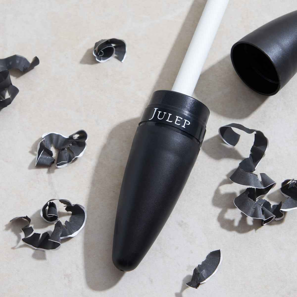 Julep sharpener held in hand displaying pocket-sized convenience