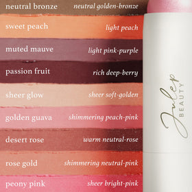 Julep stick held in hand illustrating compact size and travel-friendly use