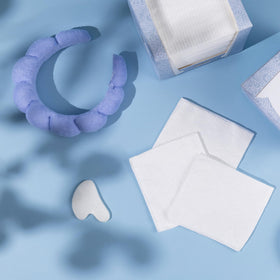 Just Clean Skin towels packed in a travel toiletry bag for convenience