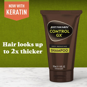Just for Men Control GX bottle in hand indicating 4 fl oz travel size