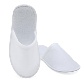 Juvale slipper held in hand to show scale and lightweight, easy-to-carry benefit