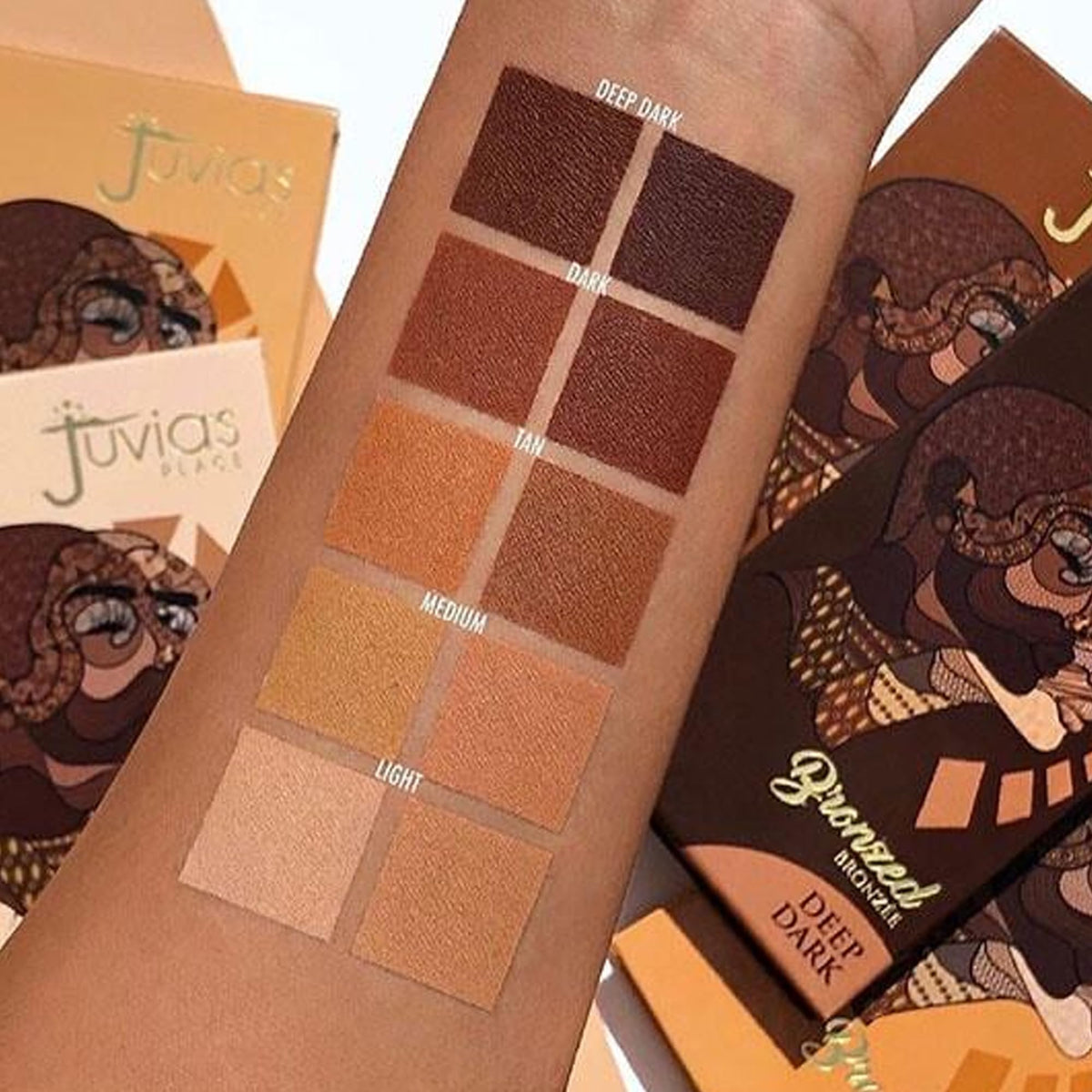 Juvia's Place brush applying bronzer showing product blendability benefit natural-looking contour