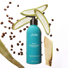 JVN Embody bottle in hand for scale showing 10 fl oz travel-friendly size