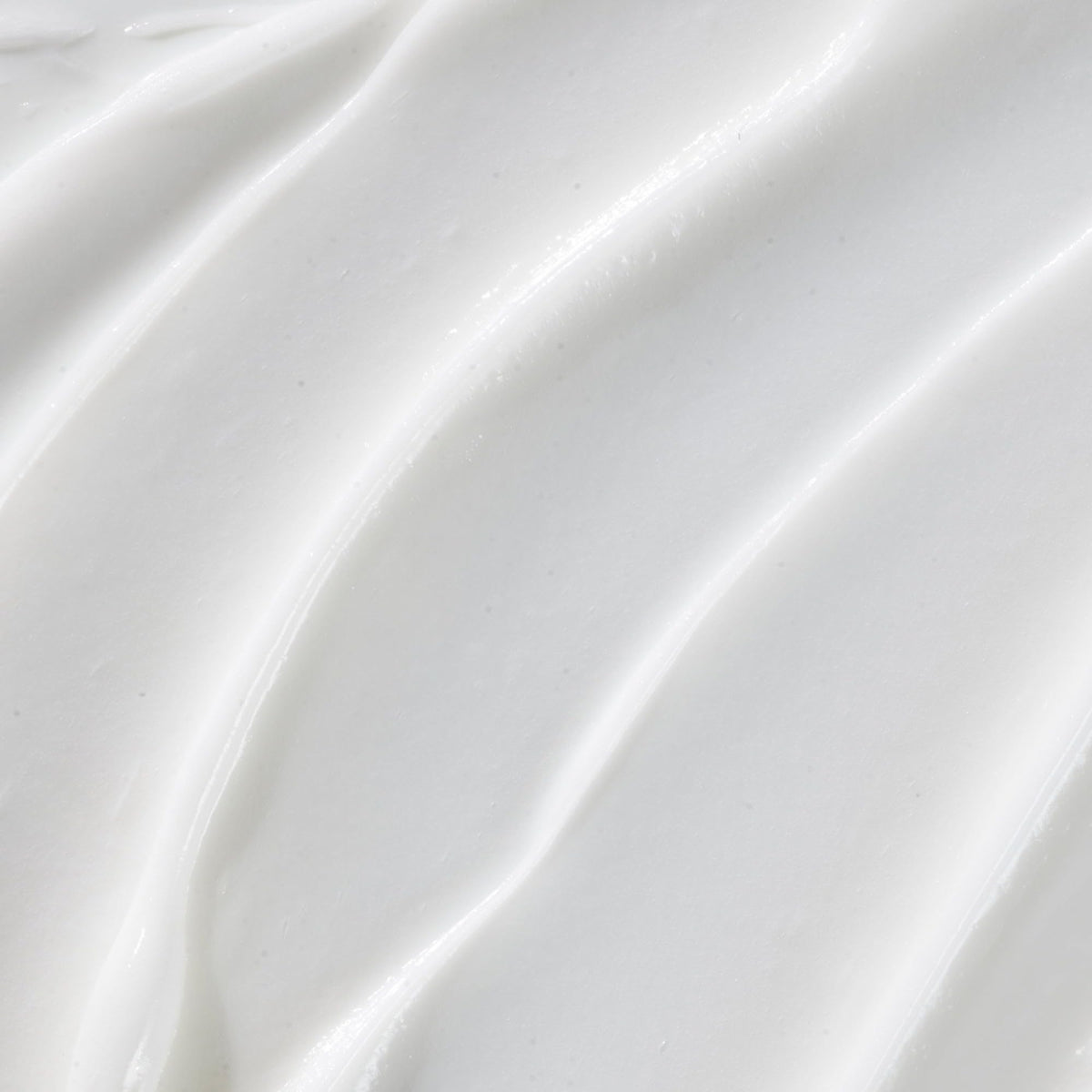 JVN camellia seed oil droplet on leaf highlighting natural shine benefit