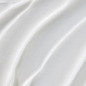 JVN camellia seed oil droplet on leaf highlighting natural shine benefit
