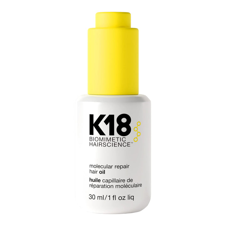 K18 front bottle view showing sleek packaging and treatment benefits