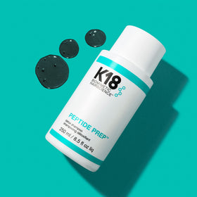 K18 shampoo lather on wet hair demonstrating effective buildup removal