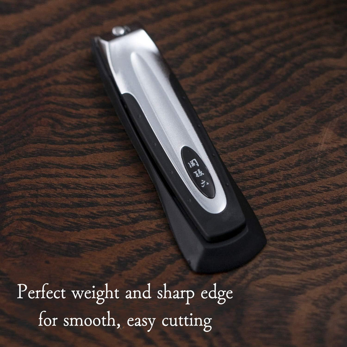 KAI nail catcher open in handle collecting trimmings for no-mess grooming