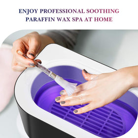 KARITE hand dipping into warm paraffin demonstrating hydration and soothing benefit