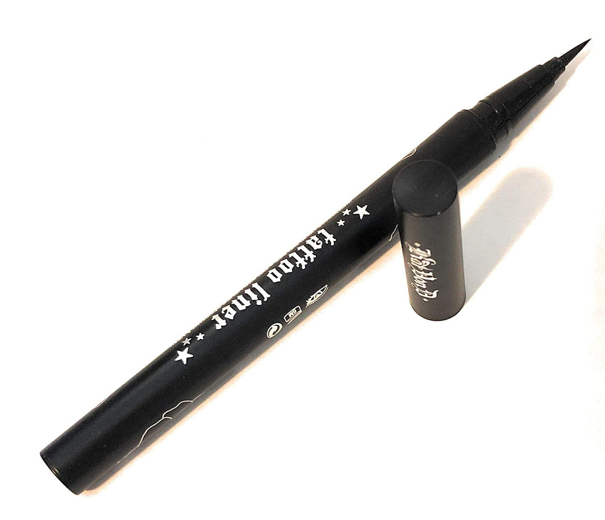 Kat Von D tattoo liner application on eye creating a sharp wing