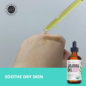 Kate Blanc jojoba oil next to essential oils for easy DIY serum blending