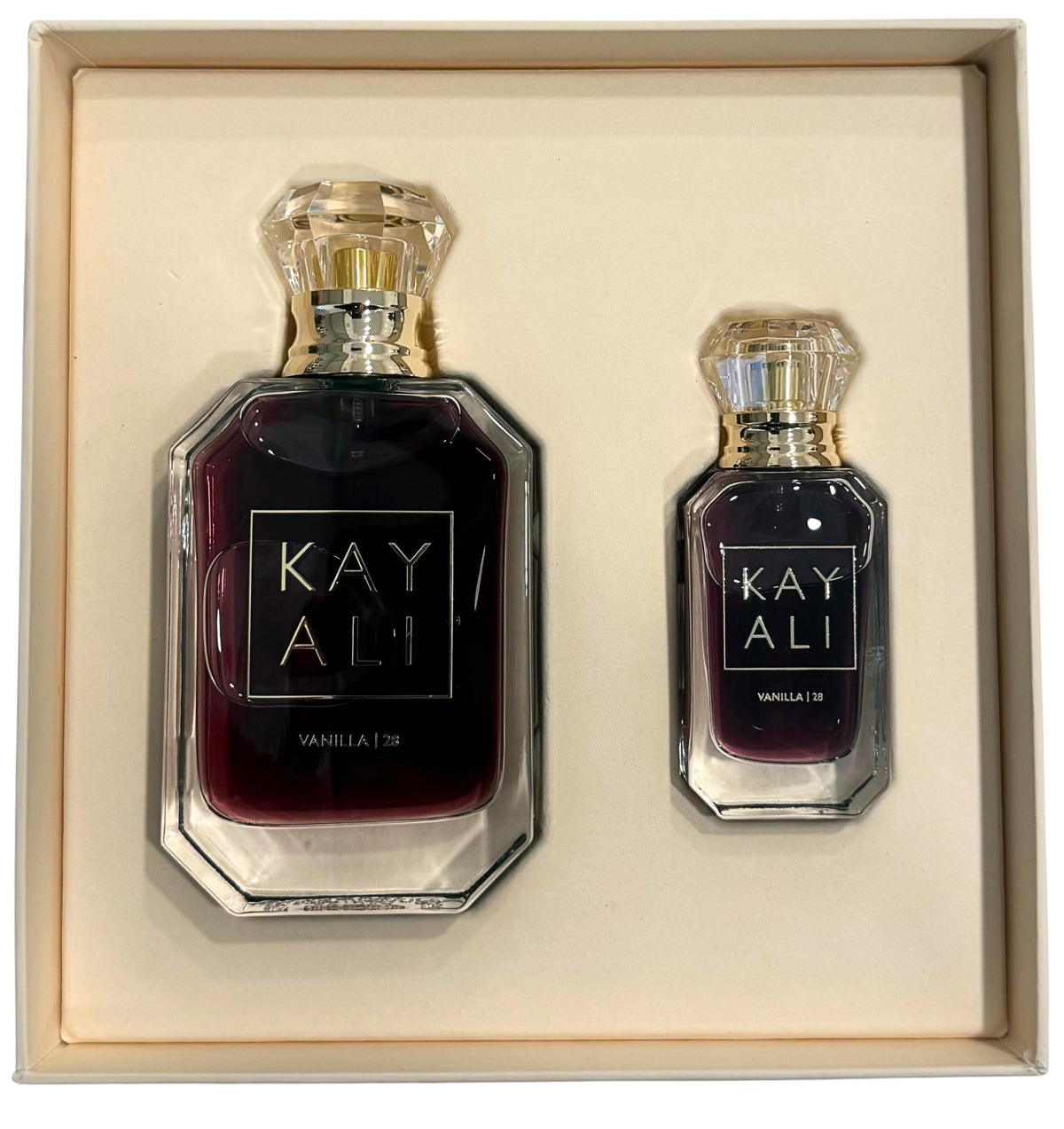 KAYALI Vanilla | 28 bottle detail close-up highlighting glass and label, quality feel