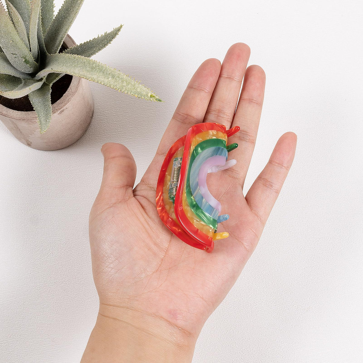 KCHIES rainbow clip side profile highlighting spring and jaw shape for secure hold