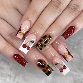 Kcjckcdd nails worn at a party, adding bold style to an outfit