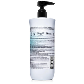 Kenra Clarify Shampoo next to ruler showing 33.8 fl. oz. scale for true size reference