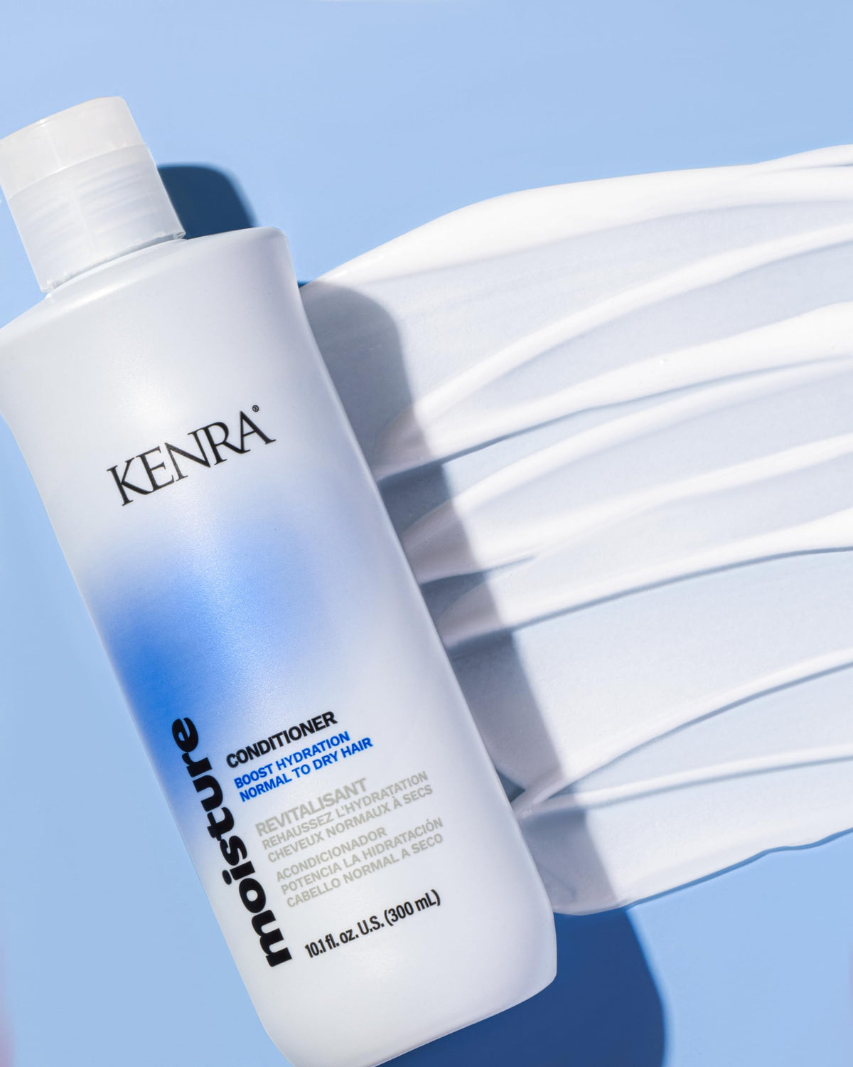 Kenra dispensing conditioner texture demonstrating creamy slip for easier detangling