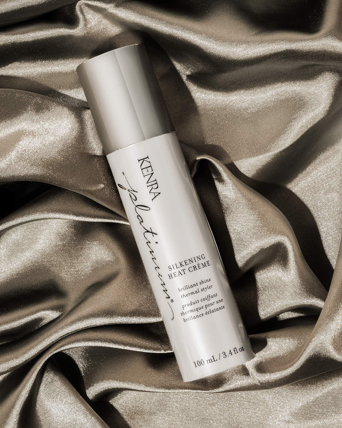 Kenra Platinum being applied to damp hair, improves manageability and faster styling