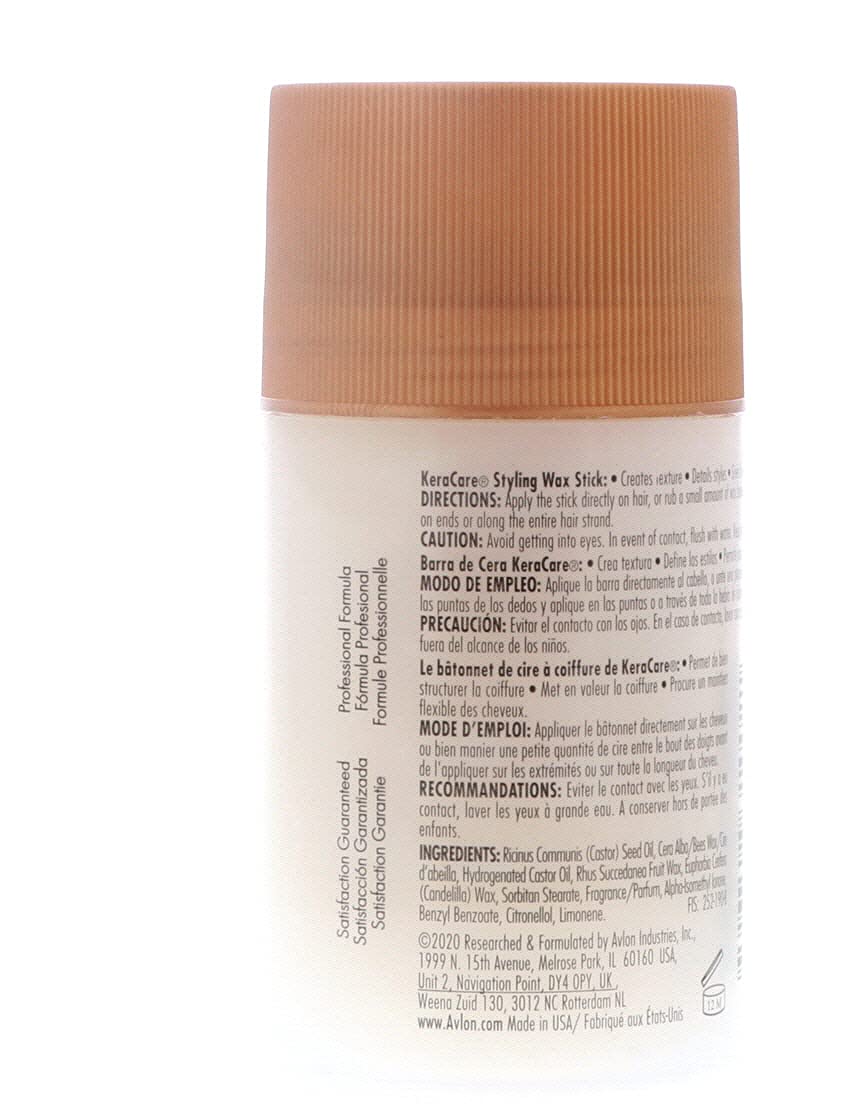 KeraCare wax stick held in hand demonstrating size and easy on-the-go use