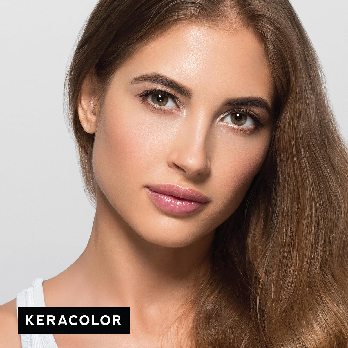 KERACOLOR being applied to dry hair for intense pigment deposit and bold tone benefit