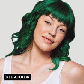 KERACOLOR being worked into wet hair showing even color deposition benefit