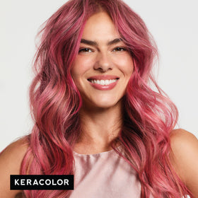 KERACOLOR applying hot pink clenditioner to lightened hair for vibrant color