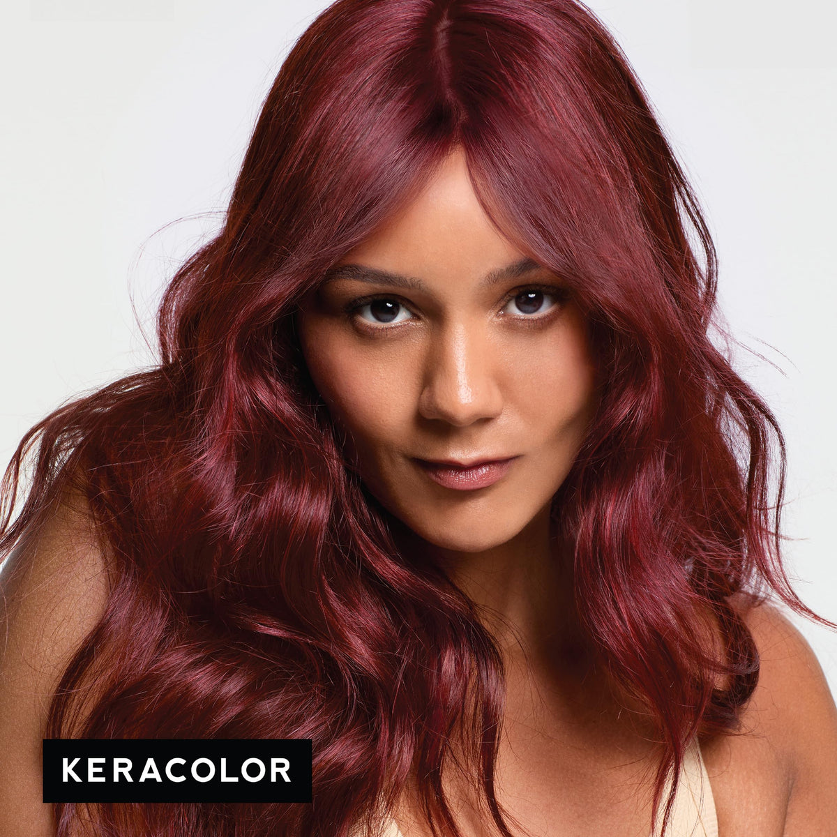 KERACOLOR Merlot being applied to hair for a visible color-depositing result