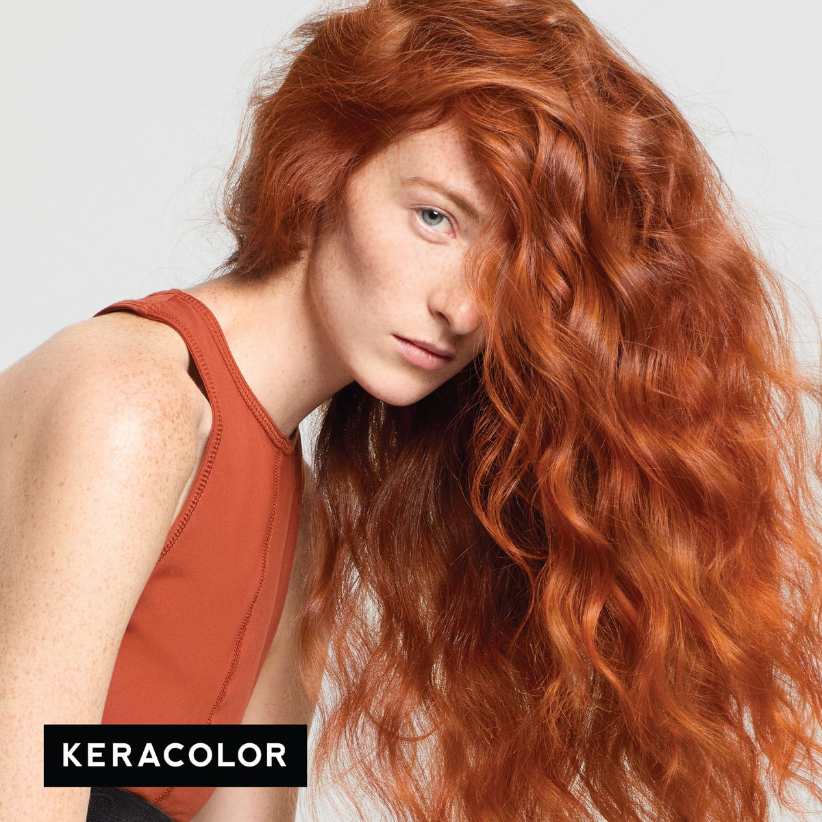KERACOLOR pouring Clenditioner into hand for application and even color coverage benefit