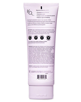 Keranique travel-friendly bottle on towel for convenient grooming benefit