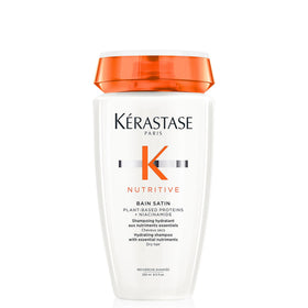 KÉRASTASE bottle front label showing product and benefits