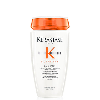 KÉRASTASE bottle front label showing product and benefits