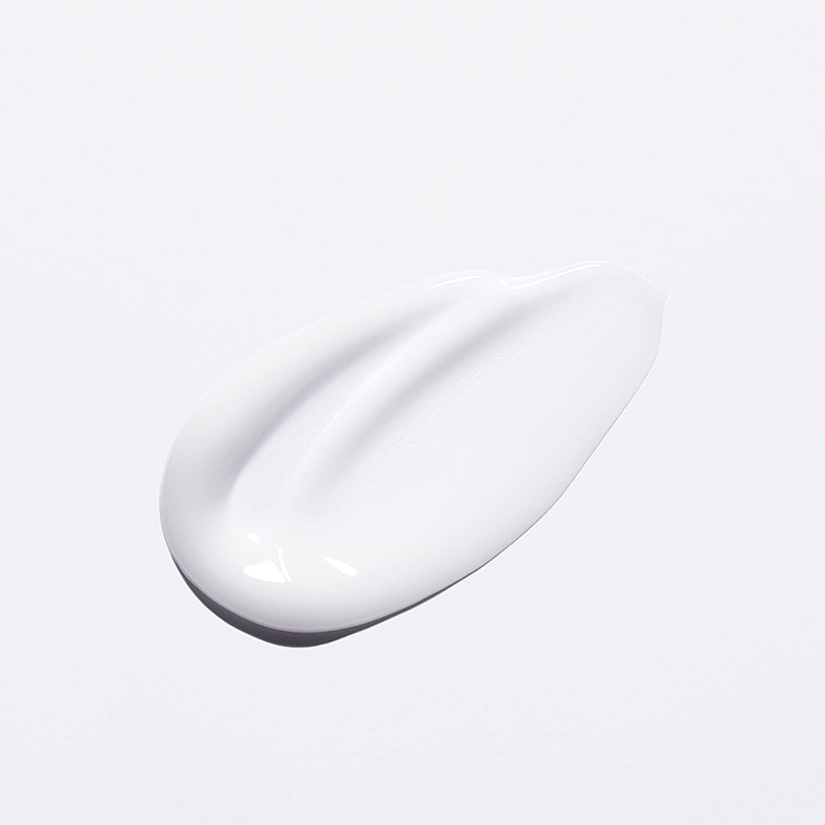 KÉRASTASE bottle in bathroom setting suggesting everyday salon-grade routine