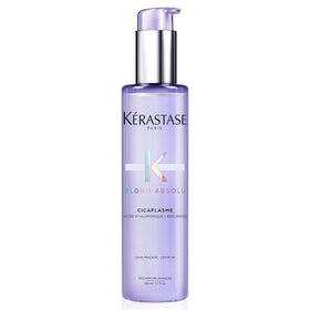 KÉRASTASE bottle front view showing sleek packaging and brand benefit