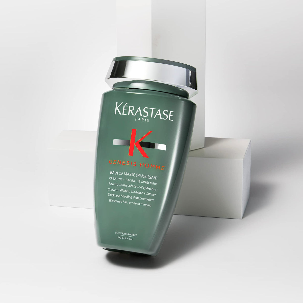 KÉRASTASE placed on bathroom shelf in lifestyle scene suggesting daily use