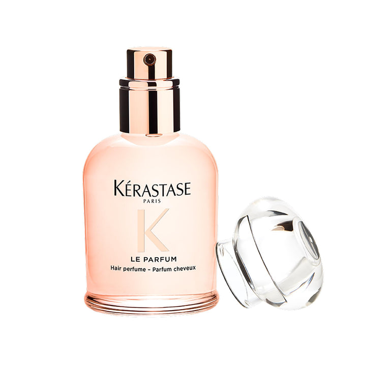 KÉRASTASE bottle front view showing compact travel-ready design and luxury scent
