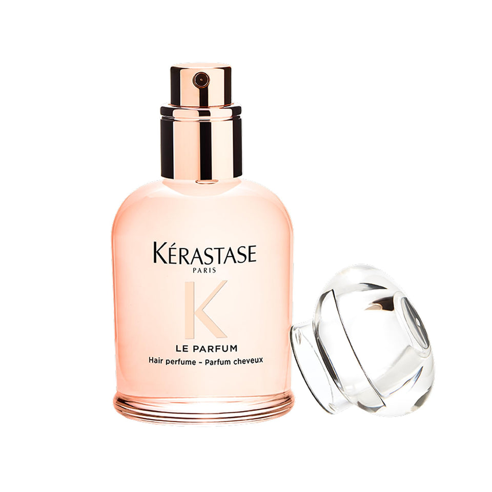KÉRASTASE bottle front view showing compact travel-ready design and luxury scent