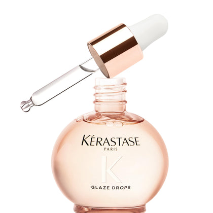 KÉRASTASE bottle front view showing elegant packaging and glossy finish benefit